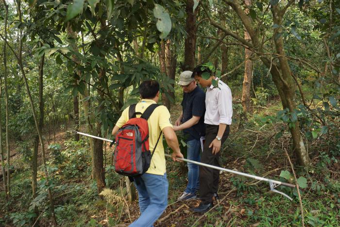 Prof. Hoang Van Sam, Pham Thanh Ha and Prof. Gregor Kozlowski in the Botanic Garden of VNUF